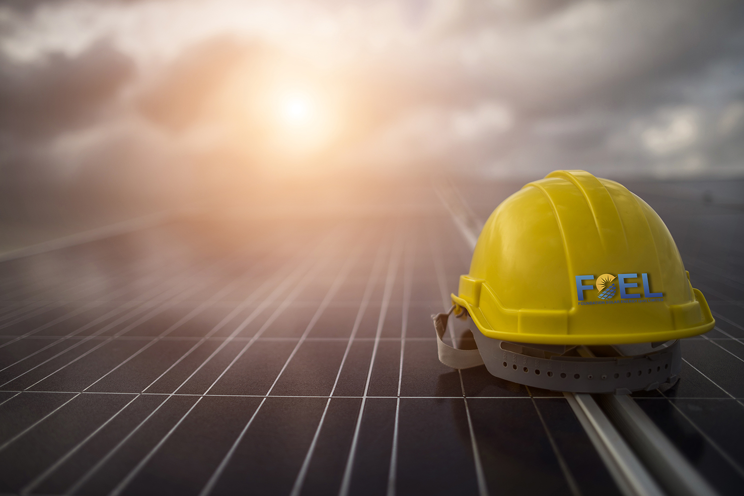 Yellow safety helmet on solar cell panel